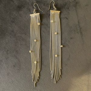 Silver like earrings, with crystal accents.
